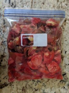 Cut up tomatoes in a freezer bag can be frozen for later use.  Freezing is an easy way to preserve fruit and vegetables